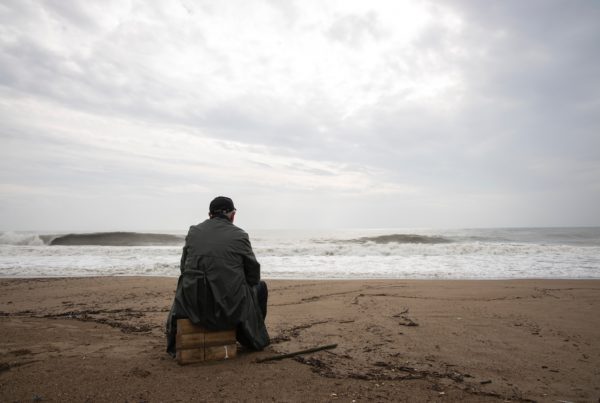 Elder on the beach alone