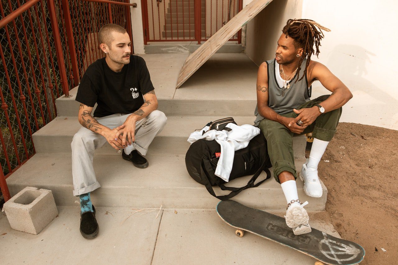 Two people talking on steps